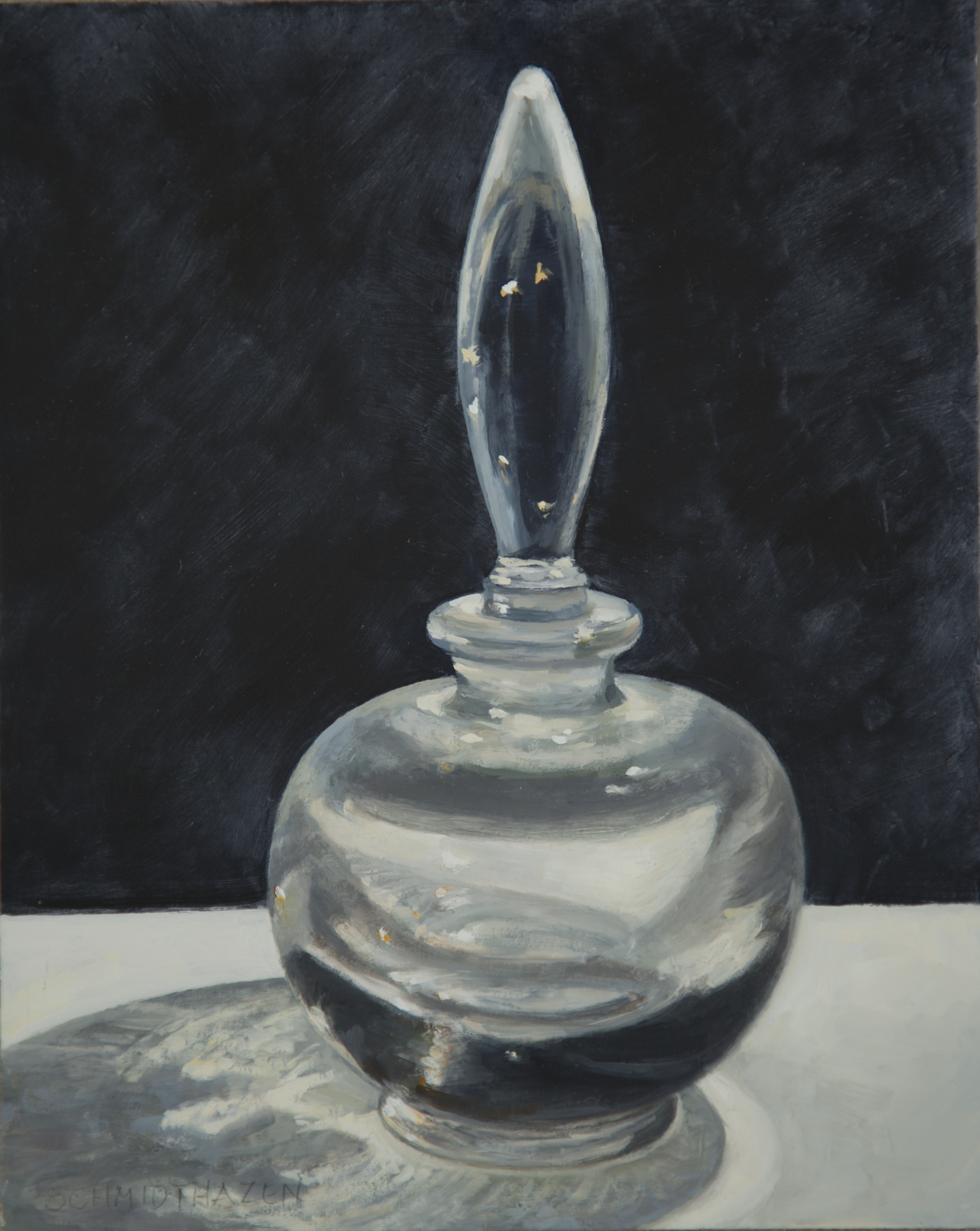 round perfume bottle with indigo background